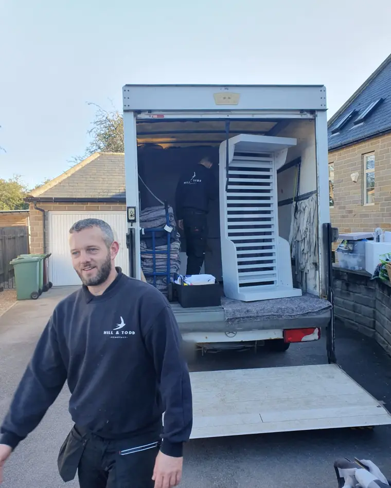 Loading the van: blankets on the rack, furniture going on